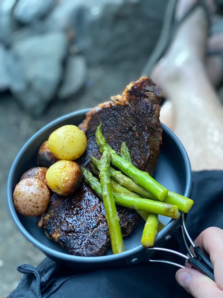 A solid NY strip cooked over coals