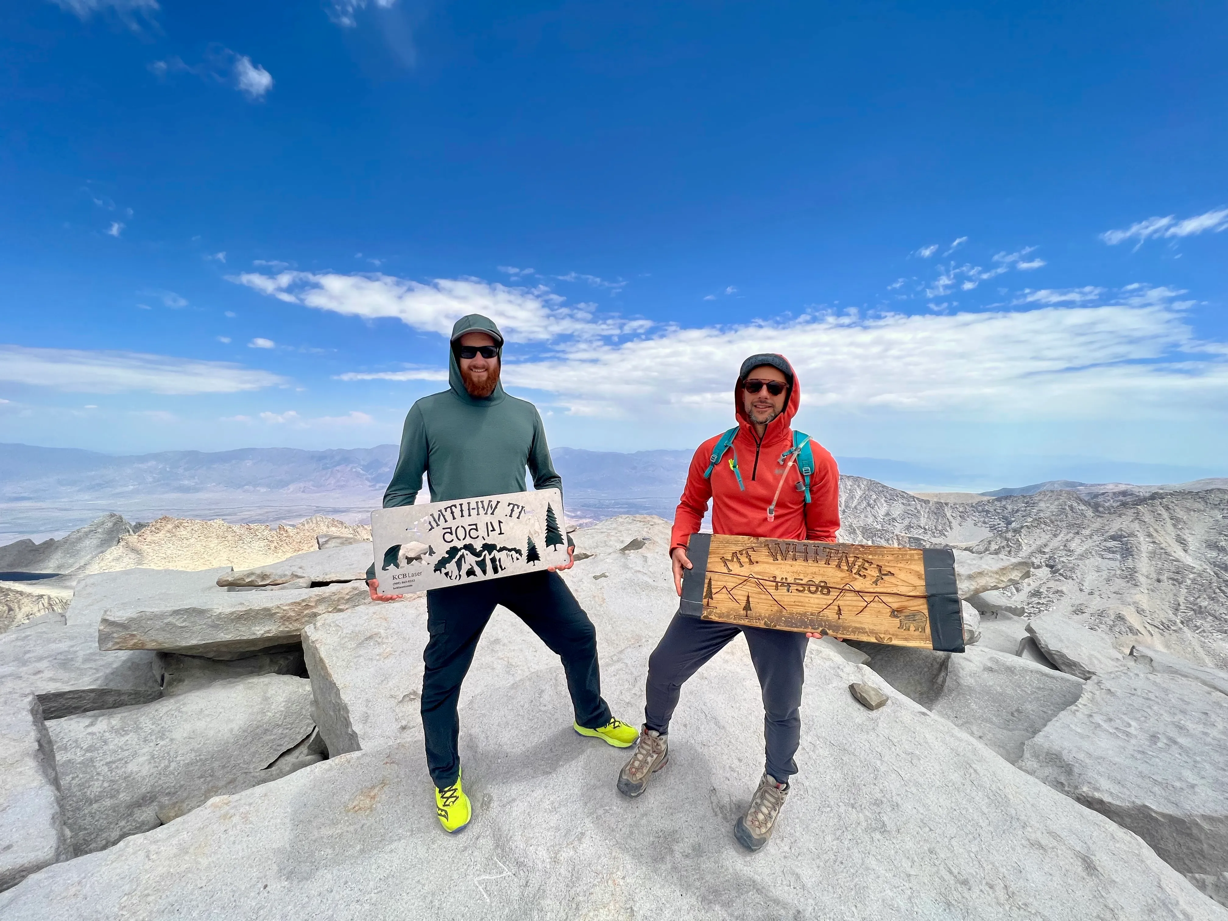 The stone summit hut on Mount Whitney, clouds building over the Sierra
